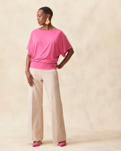 Model wearing Amalfi MELYRFLEX stretch trousers in pink check